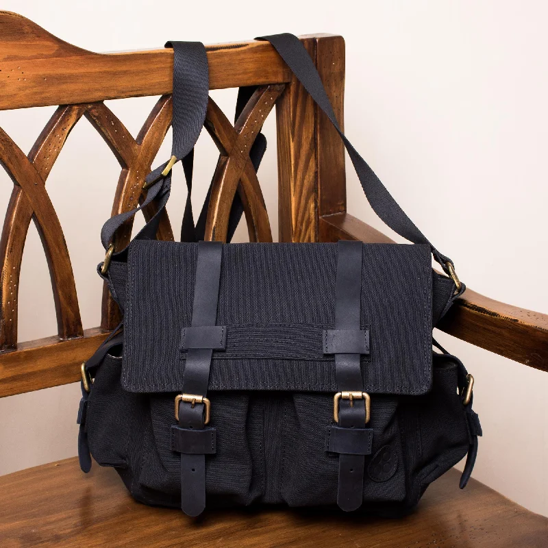 Journey to Manu in Black Leather Accented Roomy Canvas Messenger Bag in Black